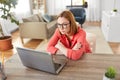 Bored woman with laptop working at home office Royalty Free Stock Photo