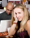 Bored woman with man on laptop computer Royalty Free Stock Photo