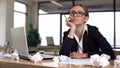 Bored woman thinking over startup in office, lacking new ideas, unmotivated Royalty Free Stock Photo