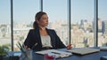 Bored worker tapping desk in modern office. Beautiful businesswoman thinking Royalty Free Stock Photo