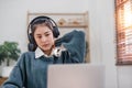 Bored young asian girl student studying, looking upset at laptop screen, attend boring online classes or lecture. Tired Royalty Free Stock Photo