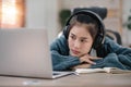 Bored young asian girl student studying, looking upset at laptop screen, attend boring online classes or lecture. Tired Royalty Free Stock Photo