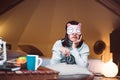 Bored young asian woman hates getting stressed waking up early 7 o`clock on bed,Alarm clock Royalty Free Stock Photo