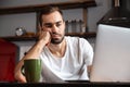 Bored young man using laptop computer Royalty Free Stock Photo