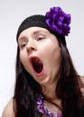 Bored Young Woman Yawning with Open Mouth