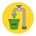 borehole pump pumps water into a bucket. collect drinking water.