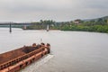 Borim,Goa/India- May 1 2020: Barges carrying mining ore for export at Borim, Goa.