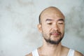 Boring face portrait casual beard bald adult mean with concrete