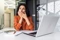 Boring and boring job business woman yawning at workplace, latin american woman with curly hair working inside office at Royalty Free Stock Photo