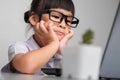 Boring job. Little businesswoman with laptop working in office. Children and business concepts Royalty Free Stock Photo