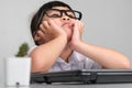 Boring job. Little businesswoman with laptop working in office. Children and business concepts Royalty Free Stock Photo