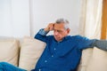 Boring stress worries the old man, the old man thinks a lot and feels an anxious, grumpy expression Royalty Free Stock Photo