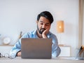 Boring Work. Arab freelancer guy working on laptop with bored face expression