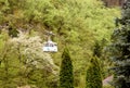 Borjomi, Georgia - May, 04 - 2019: Top view of cabin of cable car above Borjomi park