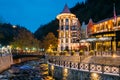 Borjomi, Samtskhe-Javakheti, Georgia. Crowne Plaza Borjomi Hotel House And Pedestrian Bridge Over River Borjomula At