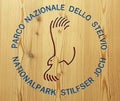 BORMIO, IT - JUNE 2018: Stelvio national park logo encarved in a wooden surface Royalty Free Stock Photo