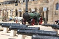 Bormla, Malta, July 2016. Exposition of the military museum in the old fortress, cannons and locomotive.