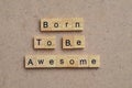 born to be awesome text on wooden square, motivation quotes.