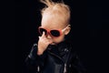 Born to be rock and roll star. Adorable small music fan. Little child boy in rocker jacket and sunglasses. Little rock Royalty Free Stock Photo