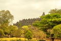 Borobudur from a distance framed by trees