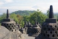 Borobudur stupas with active Merapi volcano in the background, Yogyakarta, Java Island, Indonesia