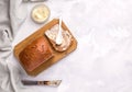 Borodino bread on a white plate with butter