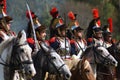 Reenactors cuirassiers ride horses at Borodino battle historical reenactment in Russia