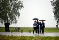 People dance in the rain on the Borodino field. Royalty Free Stock Photo