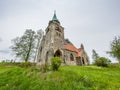 Borovnicka, Czech republic - May 15, 2021. Information board about village with Church Of The Divine Heart Of The Lord in backgrou