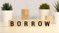 BORROW word made with building blocks isolated on white