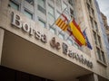 The Borsa de Barcelona (Barcelona Stock Exchange) building with Spanish and Catalan flags. Royalty Free Stock Photo