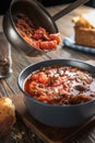 Borsch is poured into a bowl of soup ladle, traditional Ukrainian vegetable soup made from beets, carrots, tomatoes Royalty Free Stock Photo