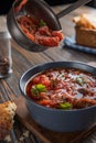 Borsch is poured into a bowl of soup ladle, traditional Ukrainian vegetable soup made from beets, carrots, tomatoes Royalty Free Stock Photo