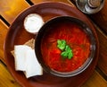 Borsch red soup with pork and sour cream, served with bread and salo Royalty Free Stock Photo