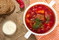 Borsch in white bowl . Red beetroot traditional soup.