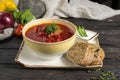 Borscht with beef and sour cream. Traditional Ukrainian vegetable soup made from beets, potatoes, cereals and boiled meat, and two Royalty Free Stock Photo