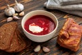 Borscht lard, rye bread and garlic on a wooden table Royalty Free Stock Photo