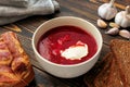 Borscht lard, rye bread and garlic on a wooden table Royalty Free Stock Photo