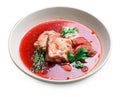 Borscht, Red Soup Made of Beetroot and Vegetables with Pork Ribs and Sour Cream on White Background Royalty Free Stock Photo