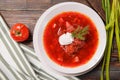 Borscht with sour cream and herbs on a wooden Royalty Free Stock Photo