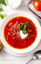 Borscht with sour cream and parsley in a white plate , red Ukrainian  soup Royalty Free Stock Photo