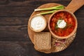 Borscht - traditional russian and ukrainian beetroot soup on wooden background. Royalty Free Stock Photo