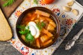 Borshch is a home-made Russian, Ukrainian and Polish national soup - red beetroot, vegetables and meat with sour cream Royalty Free Stock Photo