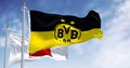 Borussia Dortmund flag waving with Bundesliga flag on a clear day