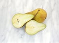 Bosc pears on marble cutting board Royalty Free Stock Photo