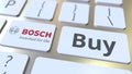 BOSCH company logo and Buy text on the keys of the computer keyboard, editorial conceptual 3D rendering Royalty Free Stock Photo
