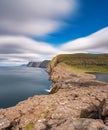 Bosdalafossur waterfall vertical composition ultra long exposure, Faroe Islands Royalty Free Stock Photo