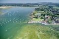 Bosham Village with boats in the estuary aerial view.