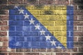 Bosnia Herzegovina flag on brick wall background Royalty Free Stock Photo