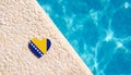 Bosnia and Herzegovina flag in the shape of a heart near the pool in the hotel. Royalty Free Stock Photo